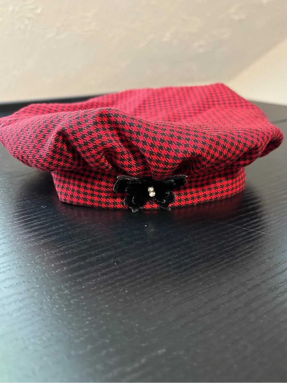 Vintage Bonnie Baby houndstooth cap with velvety butterfly applique. Size 6-9 M